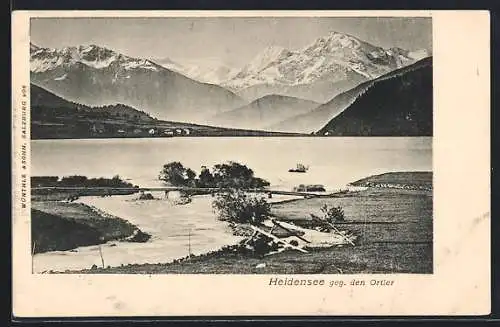 AK St. Valentin auf der Haide, Heidensee, Uferpartie mit Brücke gegen den Ortler