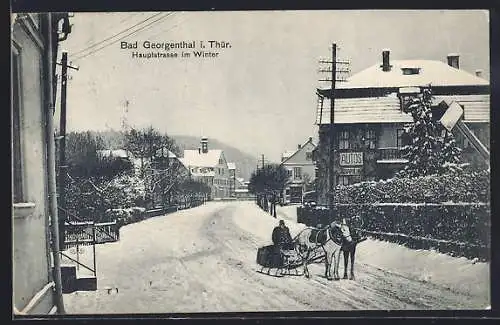 AK Bad Georgenthal i. Thür., Hauptstrasse im Winter mit Pferdeschlitten