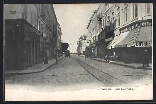AK Cannes, Rue d`Antibes avec boutiques et passants