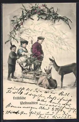 AK Kinder mit Tannenbaum auf Schlitten mit Rehen, Weihnachtsgruss