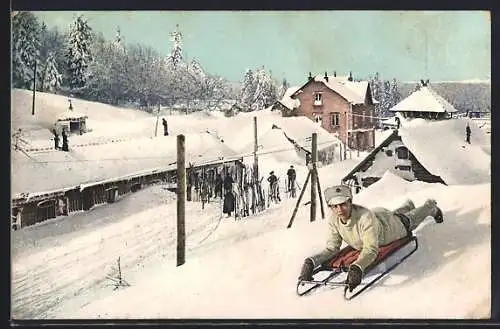 AK Junge auf einem Schlitten im Winter