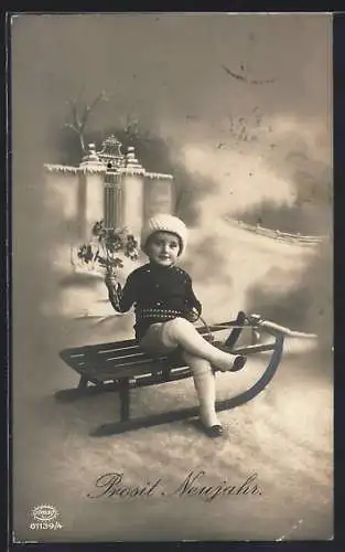 AK Kleiner Junge mit Blumen auf Schlitten, Neujahrsgruss