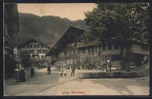 AK Wilderswil, Strassenpartie mit Bewohnern des Ortes