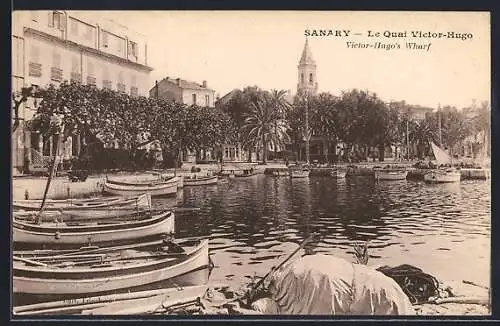 AK Sanary, Le Quai Victor-Hugo avec barques et palmiers