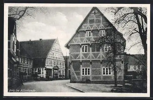 AK Jork, Strassenpartie mit Fachwerkhäusern und Geschäften