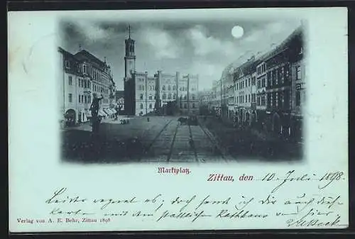 Mondschein-AK Zittau, Marktplatz mit Geschäften und Rathaus