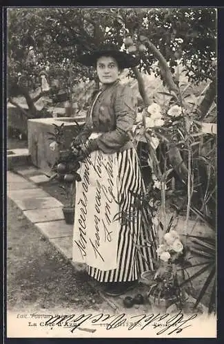 AK Hyères, Femme dans un jardin avec des fleurs et des arbres fruitiers