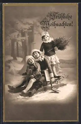 AK Kinder mit Paketen auf einem Schlitten, Weihnachtsgruss