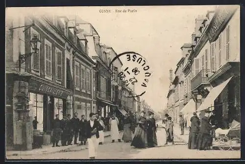 AK Cosne, Rue de Paris animée avec passants et commerces