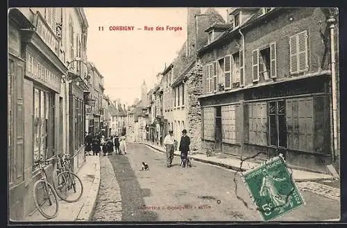 AK Corbigny, Rue des Forges animée avec passants et vélos