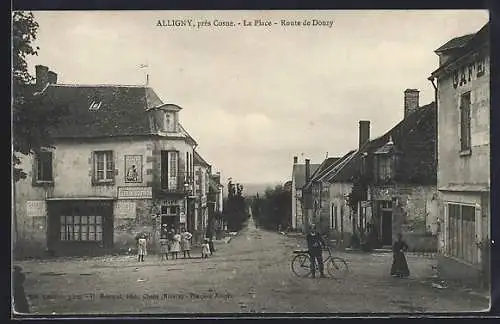 AK Alligny, La Place, Route de Donzy, scène de rue animée avec cycliste et piétons