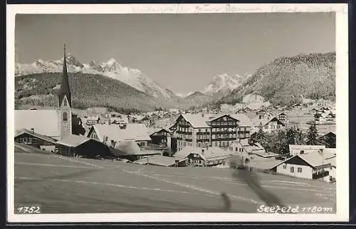 AK Seefeld, Ortspartie mit Kirche im Schnee