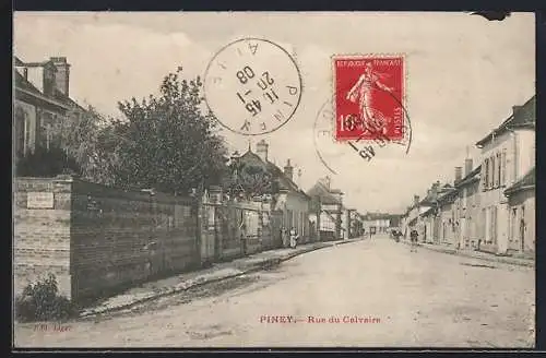 AK Piney, Rue du Calvaire avec maisons et murs en pierre