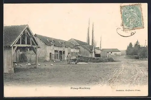 AK Piney-Rachisy, Vue de la rue principale avec chariot et bâtiments agricoles