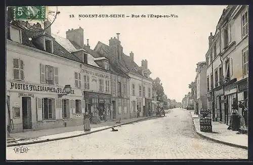 AK Nogent-sur-Seine, Rue de l`Étape-au-Vin avec bâtiments et commerces