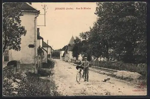 AK Jessains, Rue St-Nicolas avec cycliste et chien