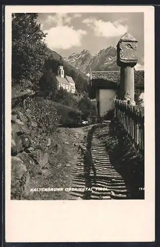 AK Kaltenbrunn /Oberinntal, Wegpartie mit Säule u. Kirche