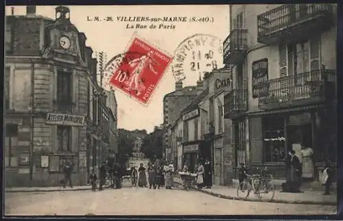 AK Villiers-sur-Marne, La Rue de Paris animée avec passants et vélos