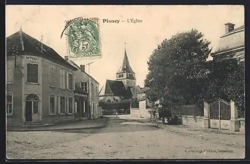 AK Plancy, L`Église et rue principale avec bâtiments adjacents
