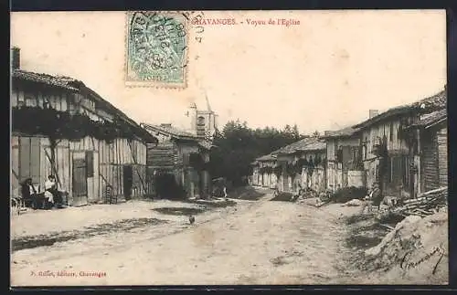 AK Chavanges, Vue de l`Église et de la rue principale avec maisons en bois