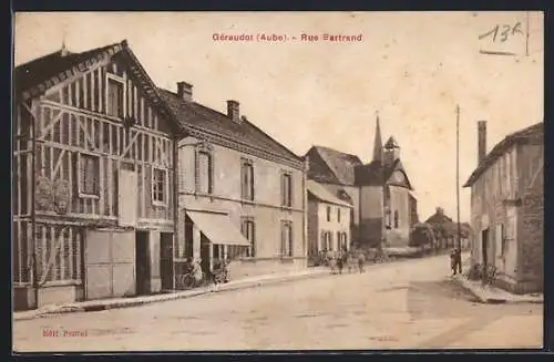 AK Géraudot, Rue Bertrand avec maisons à colombages et église en arrière-plan