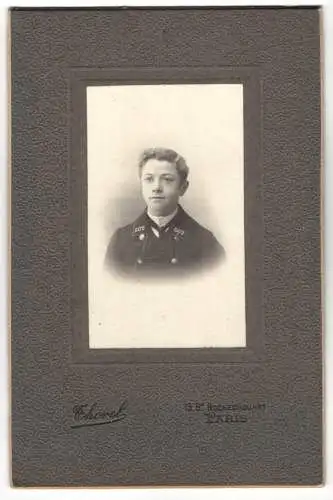 Fotografie Chorel, Paris, junger franzöischer Knabe in Eisenbahn Uniform mit Nummer 602