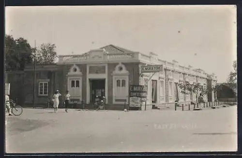 AK Poona, East Station, advertising E. Muratore confectioner
