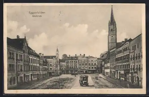 AK Eggenfelden, Stadtplatz mit Geschäften und Kirche
