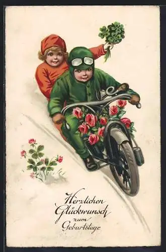 AK Kinder auf einem Motorrad mit Blumen und Kleeblättern