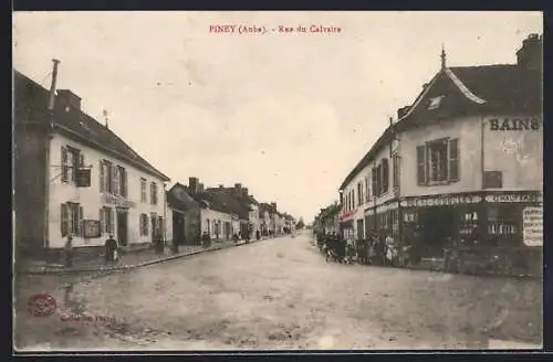 AK Piney, Rue du Calvaire avec scène de rue animée et commerces