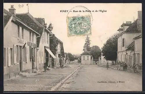 AK Piney, Rues de la Halle et de l`Église avec bâtiments et tabac