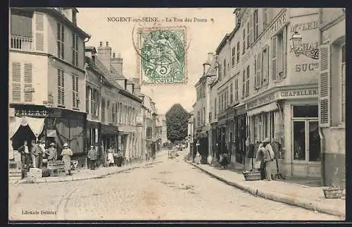 AK Nogent-sur-Seine, La Rue des Ponts animée avec commerces et passants