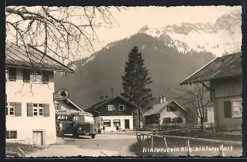AK Hinterstein /Allg., Strassenpartie mit Geschäften im hinteren Dorf