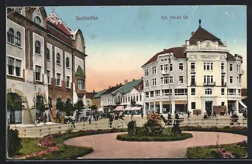 AK Szabadka, Szt. Istvan ter, Strassenleben mit Parkanlage