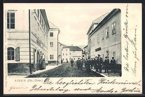AK Aigen /Ob.-Öster., Geschäft v. F. Bodingbauer, Strassenpartie mit Passanten