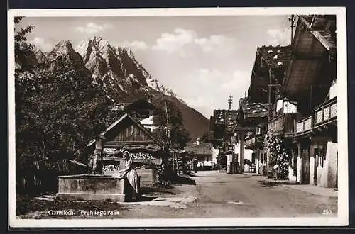 AK Garmisch, Frühlingsstrasse mit Frau am Brunnen
