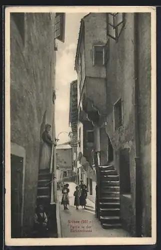 AK Brixen, Strassenpartie mit Gebäudeansicht und Kindern