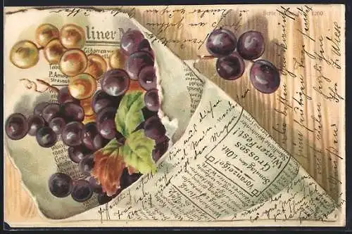 Präge-AK Weintrauben und -blatt in Zeitung eingewickelt