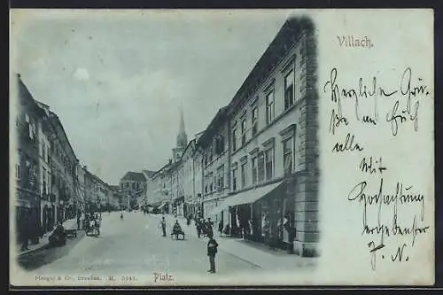 Mondschein-AK Villach, Platz mit Geschäften