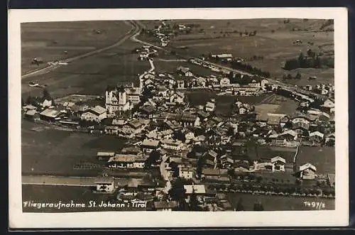 AK St. Johann i. Tirol, Teilansicht mit Kirche, Fliegeraufnahme