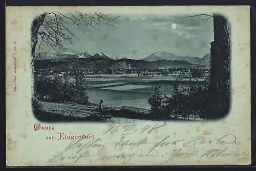 Mondschein-AK Klagenfurt, Ortsansicht mit Bergpanorama, aus der Ferne gesehen