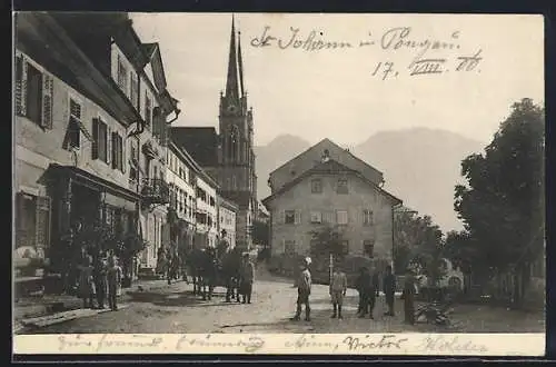 AK St. Johann i. Pongau, Strassenpartie im Zentrum mit Kirchblick