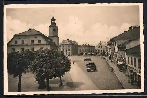 AK Römerstadt, Strassenpartie mit Geschäften