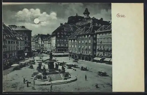 Mondschein-AK Graz, Hauptplatz mit Geschäften und Denkmal