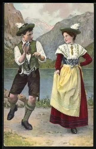 AK Schuhplattler, junges Paar in bayerischer Tracht beim Tanz am Seeufer