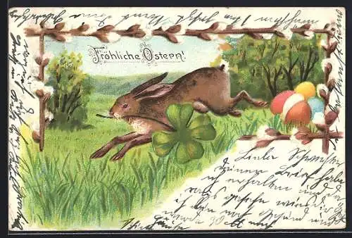 AK Osterhase mit Kleeblatt auf dem Sprung