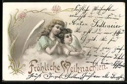 AK Weihnachtsengel beten in den Wolken, Fröhliche Weihnachten