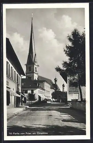 AK Prien am Chiemsee, Strassenpartie mit Kirche, Hotel Kronprinz, Bes. Max Weinzierl