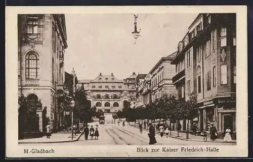 AK M.-Gladbach, Strassenpartie mit Delikatessenhandlung, Kaiser Friedrich-Halle und Strassenbahn