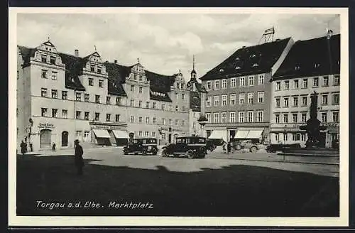 AK Torgau a. d. Elbe, Marktplatz mit Gasthaus Goldener Anker und Brunnen